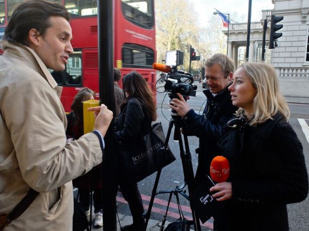 TV crew doing vox pops in front of Banksy Les Miserables January 2016